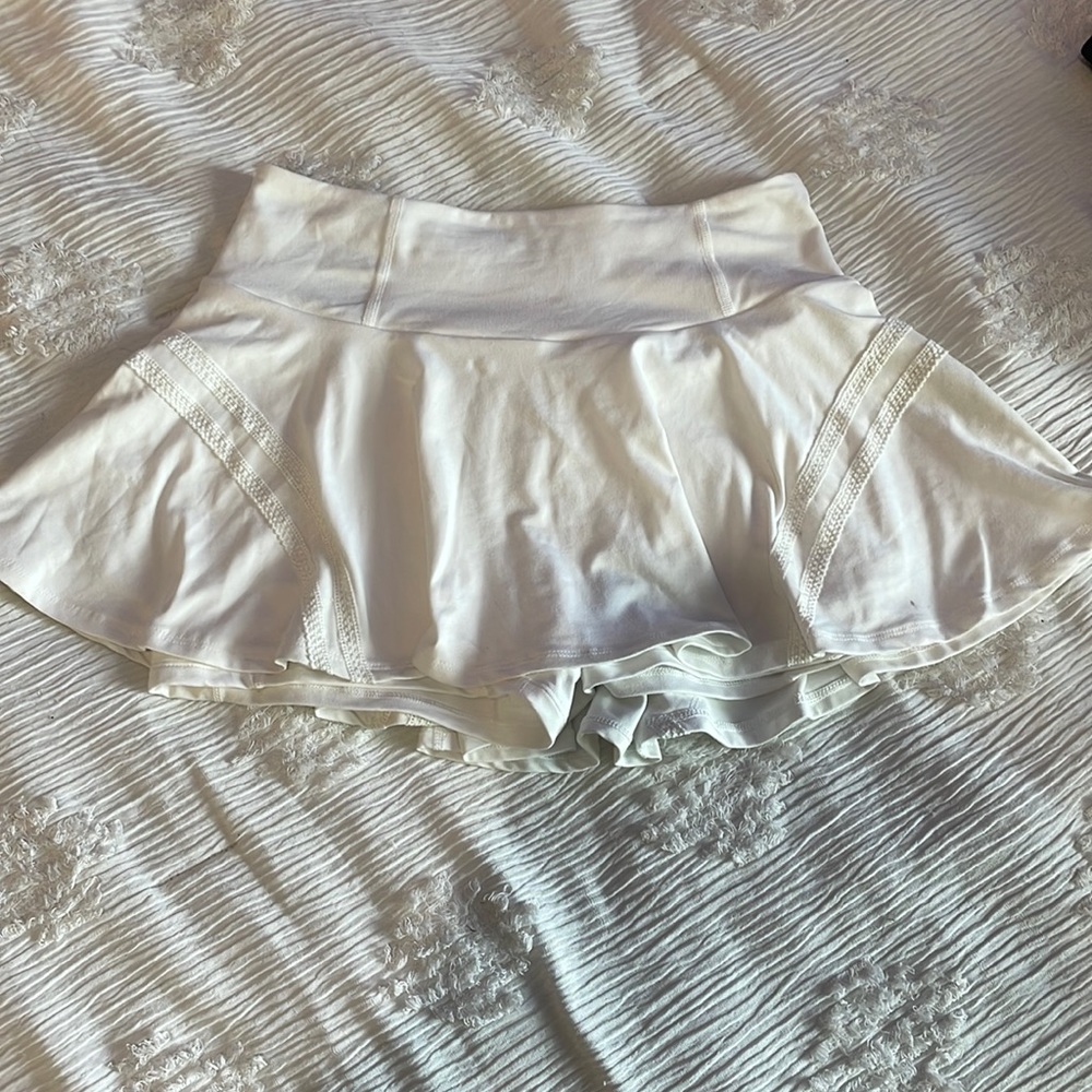 Free people movement white skirt with blue tint on back.Size large